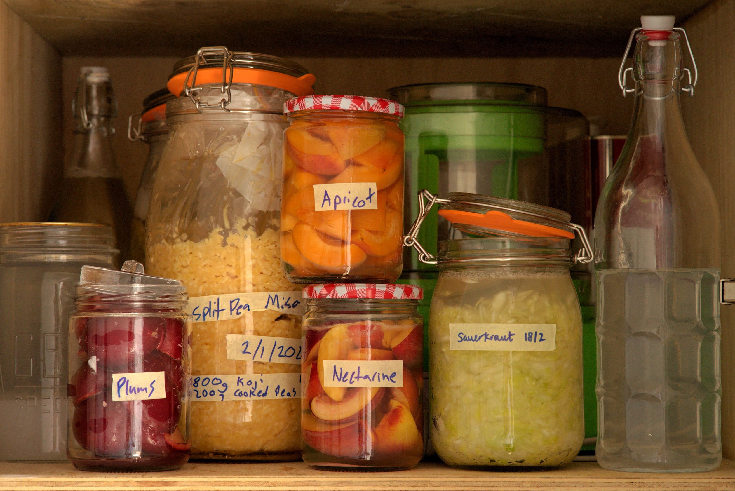 Jars of fermented stone fruit