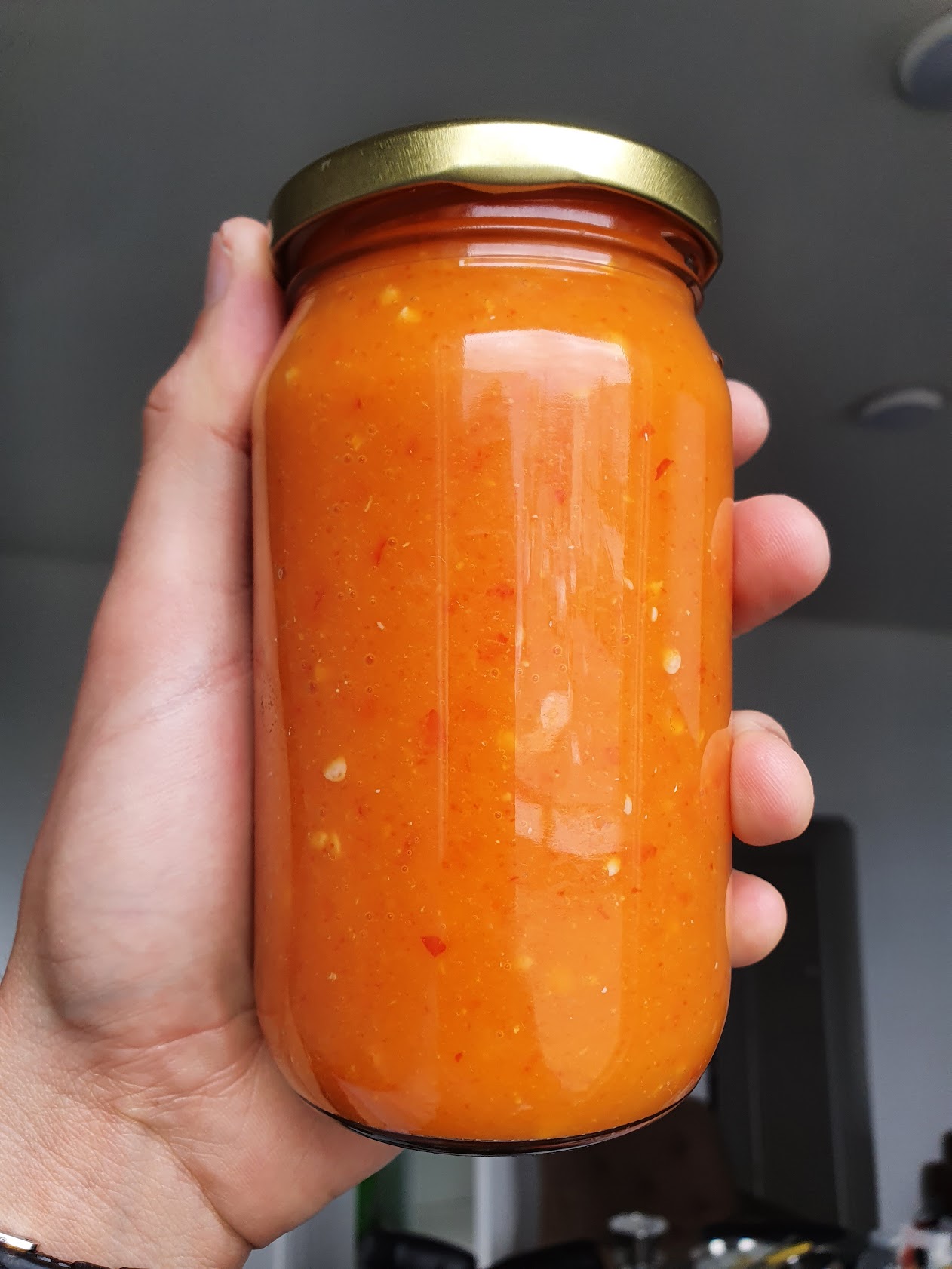 Bottle of fermented chilli mango hot sauce